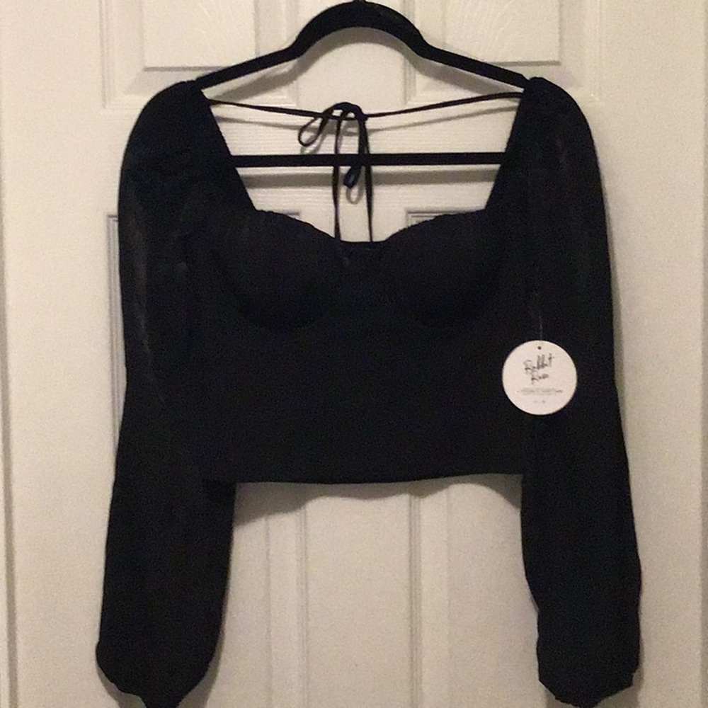 Black bustier type top, 95% polyester 5% spandex